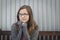 Portrait of Melancholy Teen Bookworm Girl Wearing Glasses