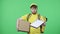 Portrait of men hands over folder to customer for signature to receive parcel. Male in yellow delivery courier uniform