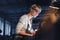 Portrait of mid adult industrial woman working indoors in metal workshop.