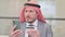 Portrait Middle Aged Arab Businessman with Online Payment Failure on Smartphone