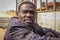 Portrait of a middle-aged black man. Worker truck in a dirty jacket