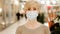 Portrait middle aged business woman with short haircut 40s lady adult female wears medical protective mask looking at