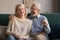 Portrait of middle aged laughing man and woman at home
