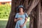 Portrait of middle-aged pregnant woman. Travel during pregnancy. Wooden texture. Maternity nature