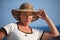 Portrait of middleaged woman in hat outdoor