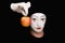 Portrait of Mime with red apple
