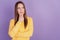 Portrait of minded thoughtful lady finger chin look empty space think on purple background