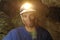 Portrait of a miner inside a mine