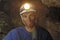 Portrait of a miner inside a mine