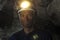 Portrait of a miner inside a mine