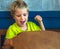 Portrait mischievous cute blond blue eyed boy making freckles face play laughing in happy mood. Funny photo, happiness