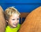 Portrait mischievous cute blond blue eyed boy making freckles face play laughing in happy mood. Funny photo, happiness