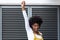 Portrait of mixed race woman shouting and raising fist