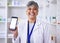Portrait, mockup phone and a woman at a pharmacy for medical service, healthcare and showing an app. Smile, contact and