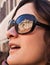 Portrait of a model with Trevi\'s fountain reflected on sunglasse