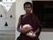 Portrait of a Monk outside Temple of the Sacred Tooth Relic