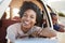 Portrait Of Mother And Children Relaxing In Car During Road Trip