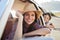 Portrait Of Mother And Children Relaxing In Car During Road Trip