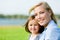 Portrait of mother and daughter against the nature view