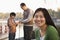 Portrait of mother with family fishing at a lake