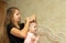 Portrait of mother makes a beautiful hairstyle for her daughter