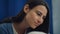 Portrait mother stroking daughter hair in clinic. Supportive family relations.