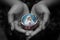 Portrait of Mother Virgin Mary in open hands. Love rosary devotion and believe in God concept