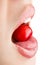 Portrait of mouth eating cherry