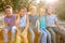 Portrait Of Multi-Cultural Children Hanging Out With Friends In Countryside Together