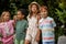 Portrait of multi-ethnic children keen on nature, spending time in garden