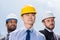 Portrait of multiathic group of professional architects in hard hats