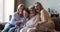 Portrait of multigenerational women family sit on sofa at home