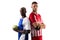 Portrait of multiracial male rival handball players standing back to back against white background
