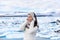 Portrait of multiracial woman on Iceland. Travel tourist in nature landscape by Jokulsarlon glacial lagoon on Iceland