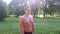 Portrait muscular young sportsman with naked torso in city park after training.