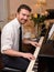 Portrait of music performer playing his piano