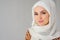 Portrait of muslim arabian woman wearing hijab, looking at camera