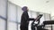 Portrait muslim sportswoman woman in hijab on step exerciser in gym