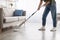 Portrait of muslim woman cleaning floor with spray mop