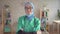 Portrait of muslim woman in hijab doctor removes bandage smiling and looking at camera