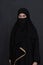 Portrait of muslim woman wearing niqab and traditional arabic clothes or abaya