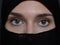 Portrait of muslim woman wearing niqab and traditional arabic clothes or abaya