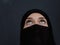 Portrait of muslim woman wearing niqab and traditional arabic clothes or abaya