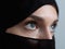 Portrait of muslim woman wearing niqab and traditional arabic clothes or abaya