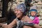 Portrait nepalese mother and child on the street in Himalayan village, Nepal