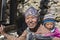 Portrait nepalese mother and child on the street in Himalayan village, Nepal