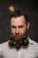 Portrait of new year man, long beard with Christmas cones