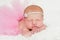 Portrait of a Newborn Baby Girl in Pink Tutu