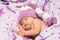 Portrait newborn baby sweetly a sleep in long gnome hat