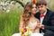 Portrait newlyweds in the lush spring garden